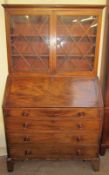 A George III mahogany bureau bookcase, the glazed top with glazing bars,