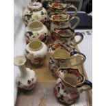 A collection of Masons Mandalay pattern jugs, vases,