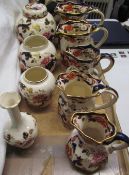 A collection of Masons Mandalay pattern jugs, vases,