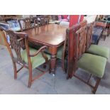 A Victorian mahogany extending dining table with rounded corners on tapering reeded legs,