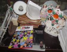 A collection of records together with a pair of Staffordshire watch figures, post cards, books,