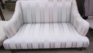 A Victorian upholstered style two seater settee