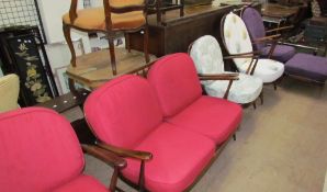 A collection of mid-20th century seat furniture, possibly Ercol including arm chairs,