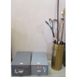 A brass umbrella stand together with a shooting stick, walking sticks,