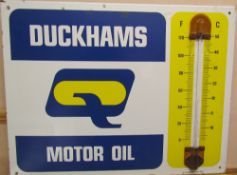 A Duckhams motor oil sign,
