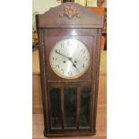 A 20th century wall clock with a silvered dial and Arabic numerals