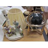 A gem set globe together with a pottery table lamp