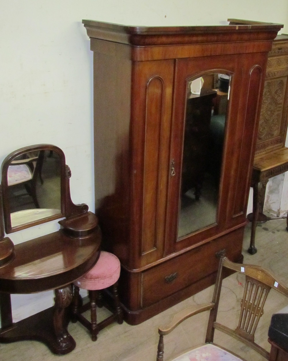 A Victorian mahogany wardrobe together with a Victorian Duchess dressing table and a stool