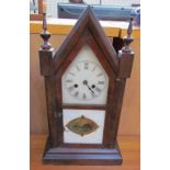 An Ansonia steeple mantle clock, the dial with Roman numerals,