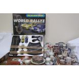 A Scalextric World Rally set together with collectors plates, Welsh pottery plaques,