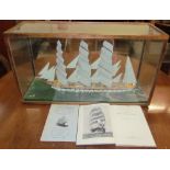 A model ship in a glass case,