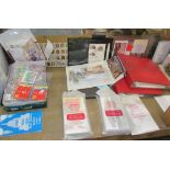 A collection of mint stamps together with stamp albums,