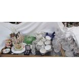 Crystal drinking glasses together with crystal decanters,