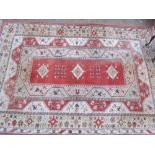 A room size orange ground rug with an orange centre,