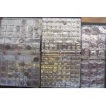 Coin albums together with a quantity of loose coins