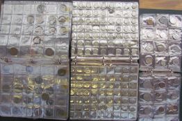 Coin albums together with a quantity of loose coins