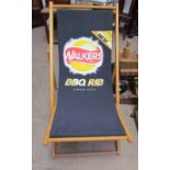 A deck chair printed with a Walkers BBQ Rib crisps advert