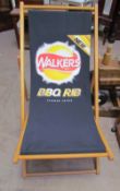 A deck chair printed with a Walkers BBQ Rib crisps advert