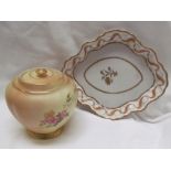 A Royal Worcester porcelain lobed jar and cover decorated worth flowers and leaves together with a