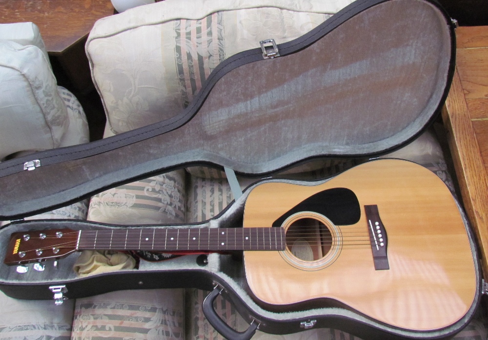 A Yamaha FG-332 six string acoustic guitar,