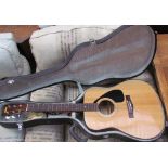 A Yamaha FG-332 six string acoustic guitar,