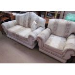 A two seater settee with matching armchair