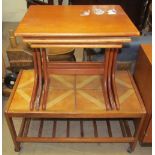 A tiled top coffee table together with a teak nest of three tables