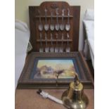 A set of twelve Franklin Mint dancing princesses spoons on a rack together with a Brian Williams