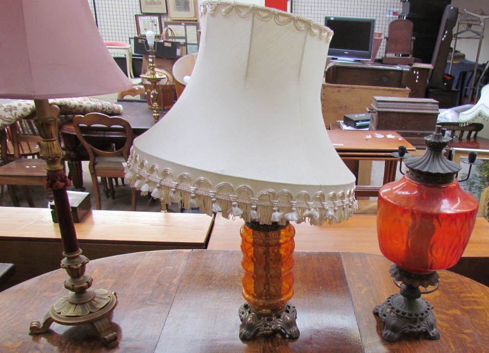 A Victorian upholstered chair together with three table lamps and a candelabra