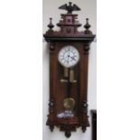 A Vienna regulator type wall clock with eagle cresting and 1/2 columns,
