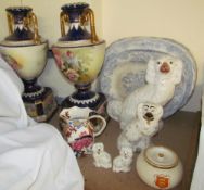 A pair of pottery vases together with blue and white pottery meat plates, Staffordshire type dogs,
