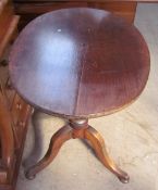 A mahogany tripod table