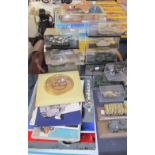 A collection of model tanks and model planes together with replica signs,