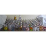 A large collection of advertising milk bottles including Knorr, Intercity, Drinking Chocolate,