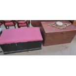 A pine coffer together with another coffer, a wicker table,