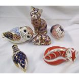 A collection of Royal Crown Derby paperweights including a cat, owl,