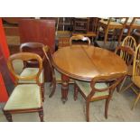 A Victorian mahogany extending dining table on reeded legs,