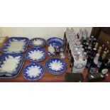 A blue and white part dinner set together with Delft pottery and Ind Coope Strong Lager brewed in