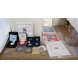 Assorted coins including a UK silver commemorative two pounds coin,