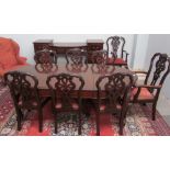 A 20th century mahogany dining suite comprising an extending dining table,