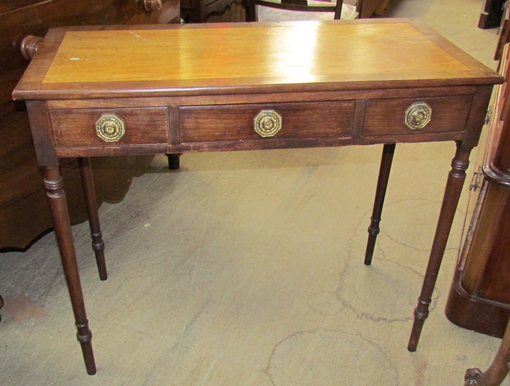 An Edwardian mahogany side table,