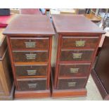 A pair of pedestals each set with four graduated drawers on plinths together with a walnut coffee