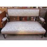 An Edwardian rosewood two seater settee, the back with floral inlay,