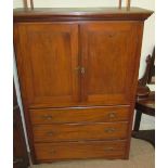 An Edwardian mahogany linen press,