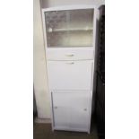 A white painted kitchen cabinet, with a pair of glazed sliding doors, a drawer,