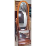 A 20th century beech framed cheval mirror together with a 19th century and later toilet mirror