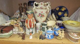 A Royal Doulton vase decorated with scrolling leaves, together with pottery figures, toby jugs,