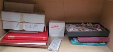 Assorted stamp albums and loose world stamps