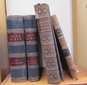 Two volumes of the Holy Bible together with Harmsworth Atlas and Gazetteer and Old England leather