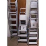 A collection of aluminium ladders, step ladders etc